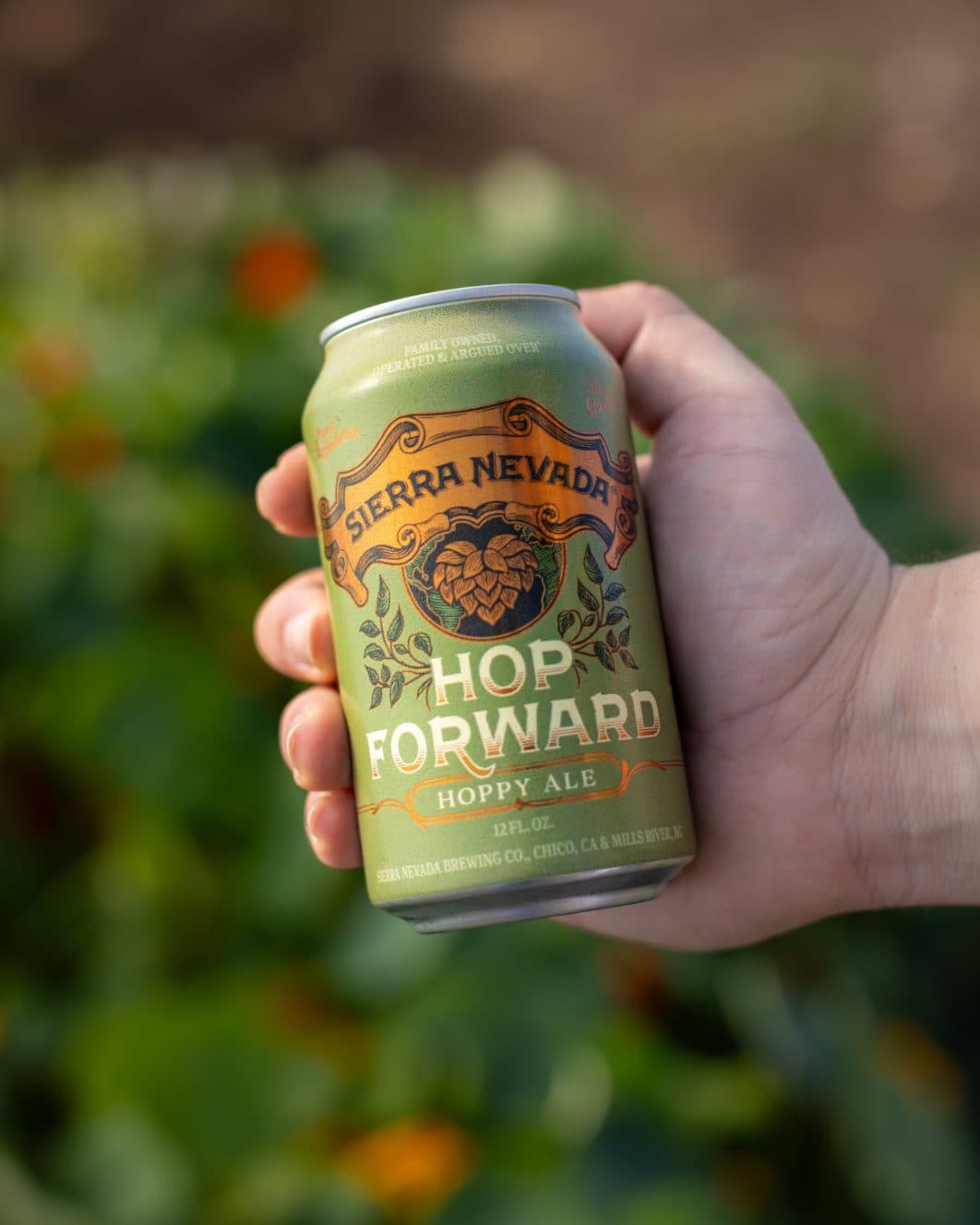 Hop Foward can in hand outside