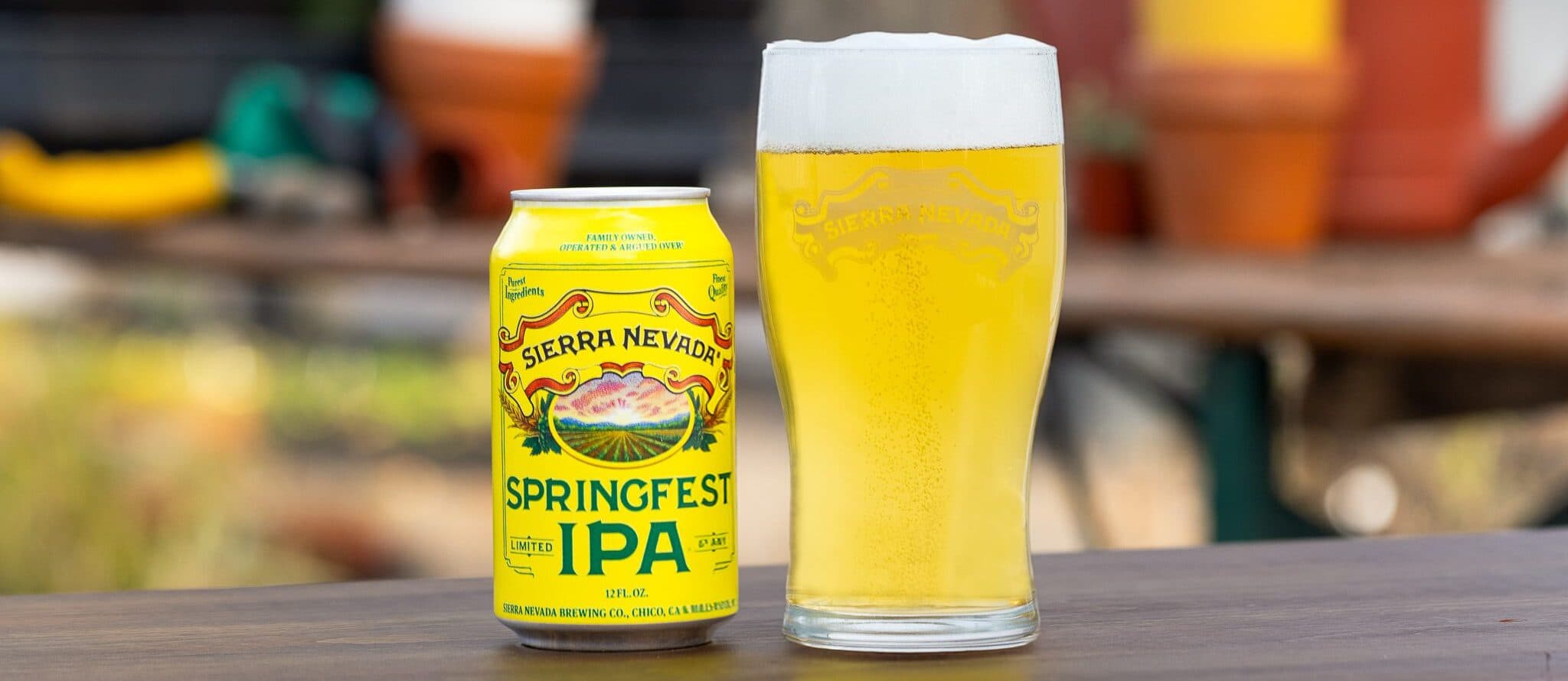 Springfest can and pint glass on table outside